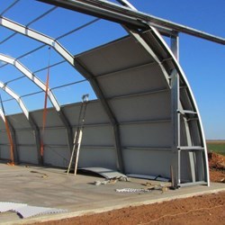 Mounting the second row of corrugated sheeting.  